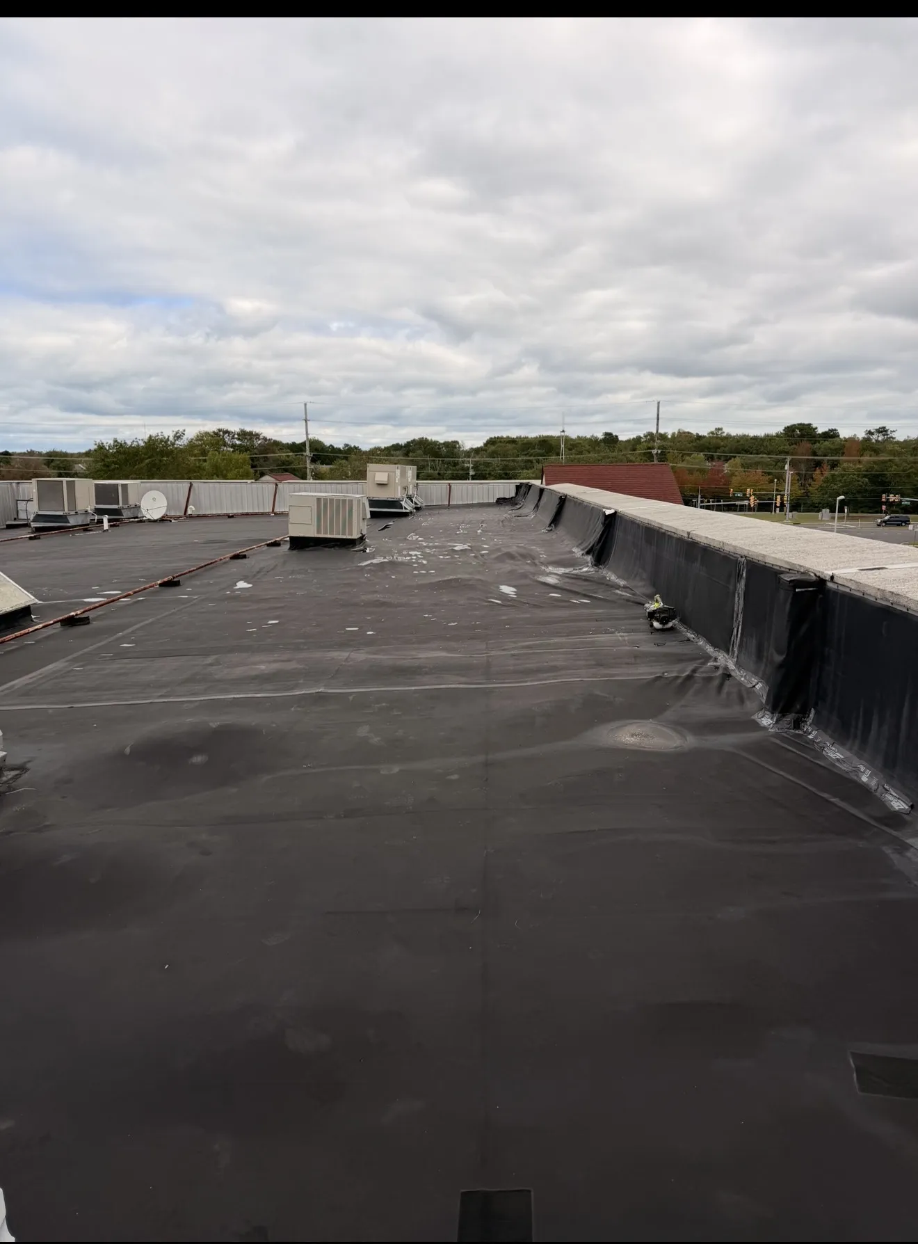 Storm Damage Roof Repair Done Right on This Commercial Flat Roof image