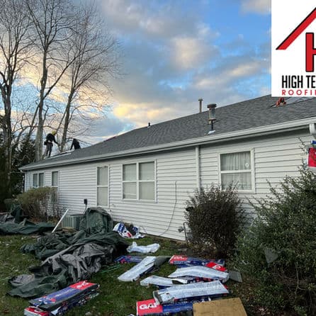 Roofing crew working on a home with trees and cloudy sky in the background. High Tech Roofing logo.